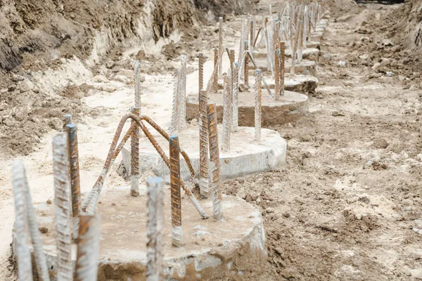 Pile foundation after completed. Before pile cap pile heads. Reinforced concrete piles of the new building. Concrete pile foundation for new construction site.