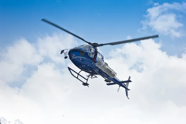 Helicopter flying on clouds — Stock Photo, Image