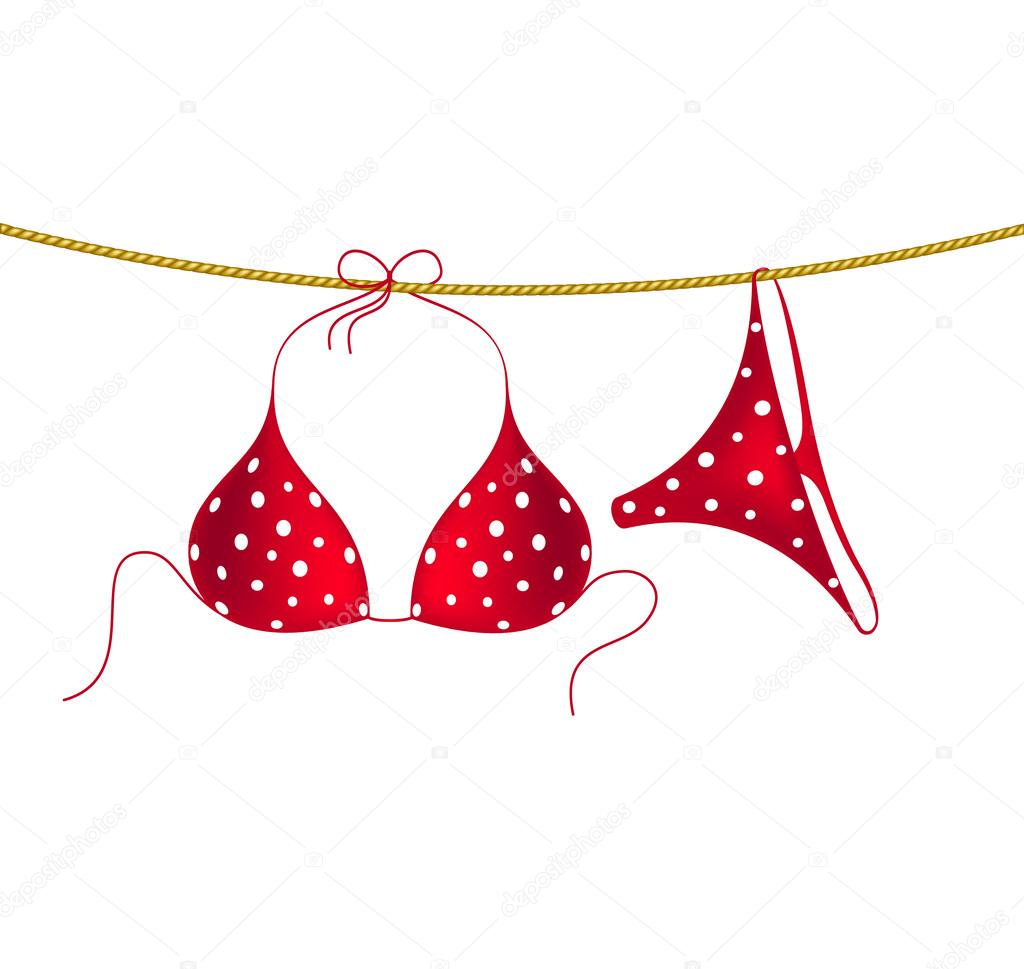 Red bikini suit with white dots hanging on rope