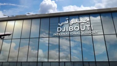 Cibuti, Jibuti 'ye bir jet uçağı iniyor. Havaalanı istikameti işaretli şehir gelişi. Seyahat, iş, turizm ve uçak taşımacılığı kavramı.