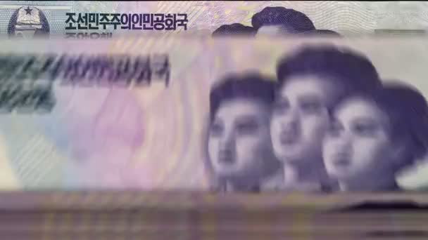 北朝鮮銀行券でお金の計算機を獲得 クイックKpw通貨は回転を下げます ビジネスと経済の概念はループ可能でシームレスな背景 — ストック動画