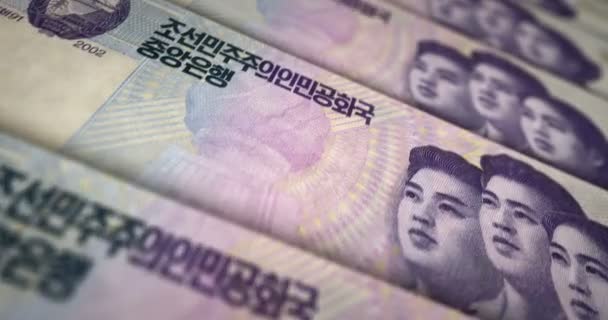 朝鲜赢得了纸币循环 Kpw货币纹理 债务和金融的概念 转移到字条上可浏览无缝3D动画 — 图库视频影像