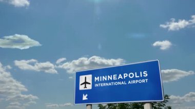 Jet uçağı Minneapolis, Minnesota, ABD 'ye iniyor. Şehir havalimanı yön tabelasıyla gelen uçak. Seyahat, iş, turizm ve uçak taşımacılığı kavramı.