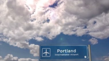Jet airplane landing in Portland, Oregon, USA. Plane city arrival with airport direction sign. Travel, business, tourism and plane transport concept.