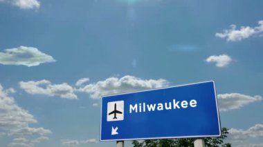 Jet uçağı Milwaukee, Wisconsin, ABD 'ye iniyor. Uçak şehri vardığında havaalanı yön tabelasıyla. Seyahat, iş, turizm ve uçak taşımacılığı kavramı.