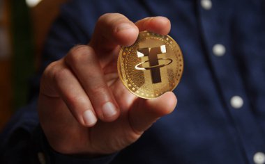 USDT 'yi bağla. Kripto altın para, elde soyut konsept.