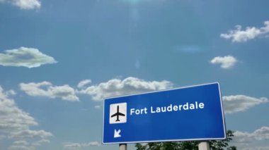 Jet uçağı Fort Lauderdale, Florida, ABD 'ye iniyor. Havaalanı istikameti işaretli şehir gelişi. Seyahat, iş, turizm ve uçak taşımacılığı kavramı.