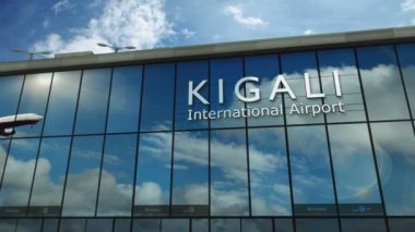 Plane landing at Kigali, Rwanda 3D. Arrival in the city with the glass airport terminal and reflection of the jet aircraft. Travel, business, tourism and transport concept.