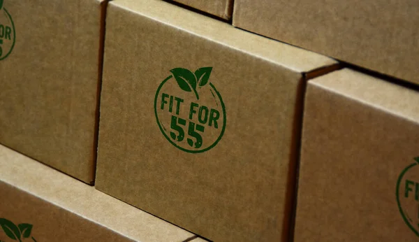 Fit for 55 stamp printed on cardboard box. European Green Deal and reduce the greenhouse gas emissions concept.