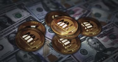 Solana SOL stablecoin cryptocurrency golden coin over Dollar banknotes. Crypto currency with US note background 3d abstract online payment and digital money concept.