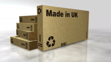 Made in UK box production line. Manufacturing and delivery. Product factory, import and export. Abstract concept rendering animation. 3D view with the camera moving around.