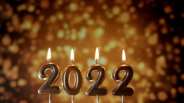 Texte 2022 allume une bougie. Joyeux Noël et bonne année. Mouvement lent — Video