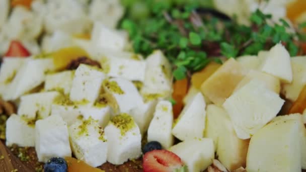 Many different gourmet cheeses and sandwiches on a table. move camera footage — Stock Video