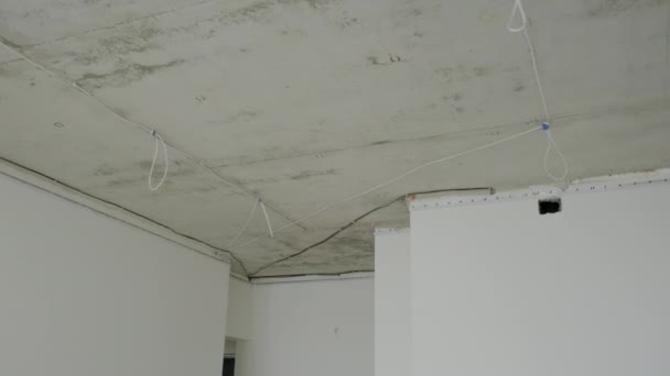 Wires attached to ceiling in room of unfinished apartments — 비디오