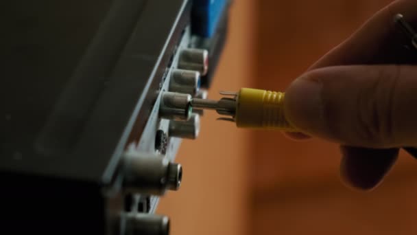 Male Hands Plug-In Rca Cables To Multimedia Electronic Device at Home. Close-Up. — Video Stock