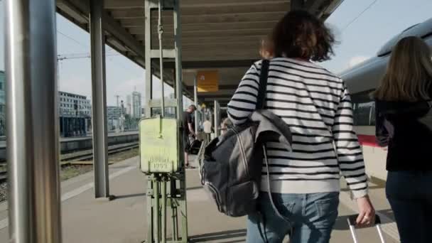 Platform railway station, passengers are waiting for the high-speed train and then boarding the train. France May 15, 2022. — ストック動画