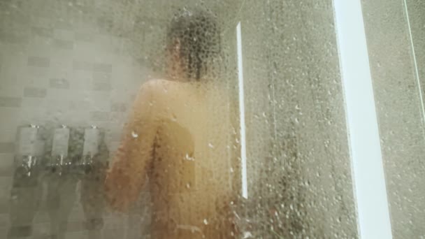 Blurred Woman Taking Shower View Misty Glass Close High Quality — Stock Video
