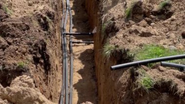 Plastic pipes laid in trenches. High quality 4k footage