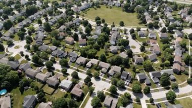 Drone view of american suburb at summertime. Establishing shot of neighborhood. . High quality 4k footage