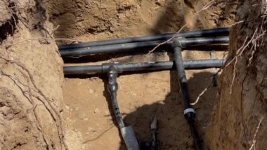 Plastic pipes laid in trenches. High quality 4k footage