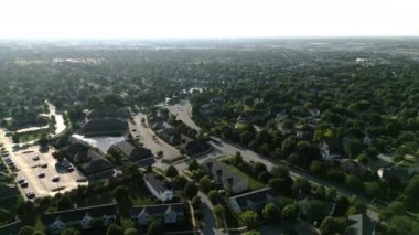 Drone view of american suburb at summertime. Establishing shot of neighborhood. . High quality 4k footage