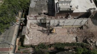  Urban Regeneration Demolition of a building for new construction. Excavator demolishing building for new construction. . High quality 4k footage