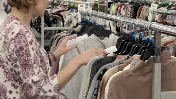 Close Female Hands Plucked Hanger Choosing Clothes Store High Quality — ストック動画
