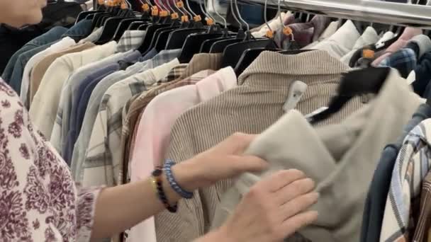 Close Female Hands Plucked Hanger Choosing Clothes Store High Quality — Vídeo de Stock