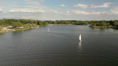Aerial view of Sailboat on lake. vacationers sail and relax on the lake . High quality 4k footage