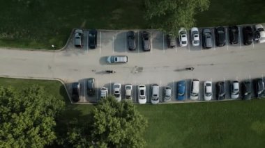 Aerial view, parking for cars in the park, recreation area. High quality 4k footage