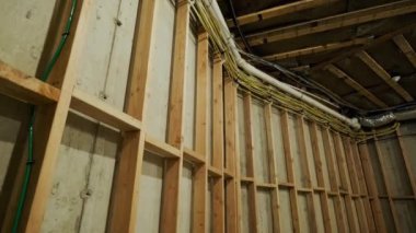 Wood building frame structure on a new development framing of new house under construction. High quality 4k footage