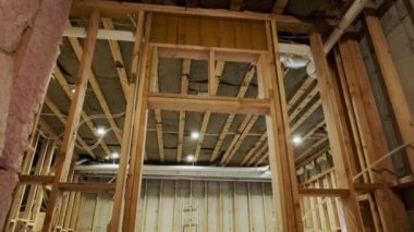 Wood building frame structure on a new development framing of new house under construction. High quality 4k footage