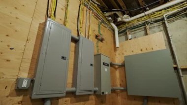 Electrical Circuit Breaker panel in new wooden home construction. High quality 4k footage