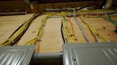 Electrical panel and laid wires in new wooden home construction Close up. High quality 4k footage