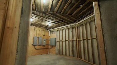 Room with Electrical Circuit Breaker panel in new wooden home construction. High quality 4k footage