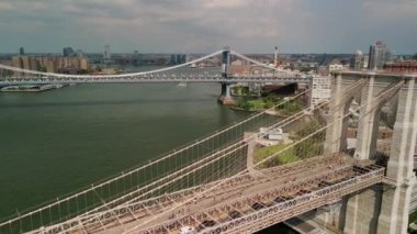 AERIAL Flight over Brooklyn Bridge and East River view over Manhattan New York City Skyline . High quality 4k footage