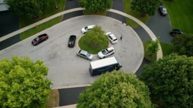 Naperville , IL , United States - 08 14 2022: Amazon vans deliver orders in the suburbs. High quality 4k footage