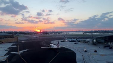 Airplane being preparing ready for takeoff in international airport in the evening. High quality 4k footage