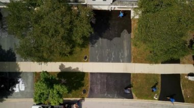 Aerial view of Driveway sealcoating pavement, Near private houses in the suburbs. High quality 4k footage
