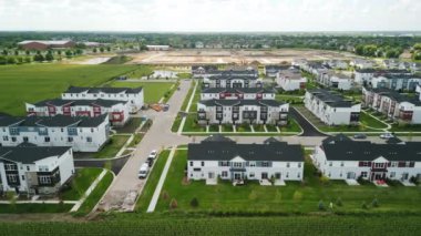 Drone view of american suburb at summertime. Establishing shot of neighborhood. . High quality 4k footage