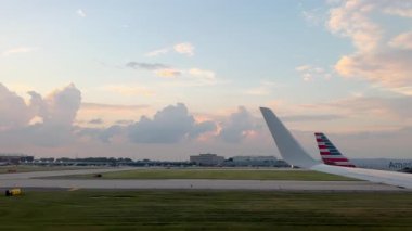  Air plane airlines approaches the runway and prepares for take off. Wide View of the wing from the porthole. High quality 4k footage