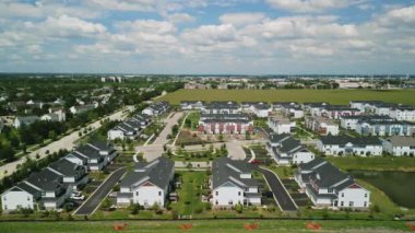 Drone view of american suburb at summertime. Establishing shot of neighborhood. . High quality 4k footage