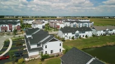 Drone view of american suburb at summertime. Establishing shot of neighborhood. . High quality 4k footage