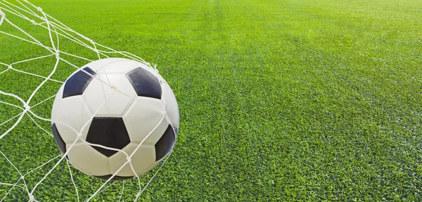 Soccer ball in a net. Royalty Free Stock Photos