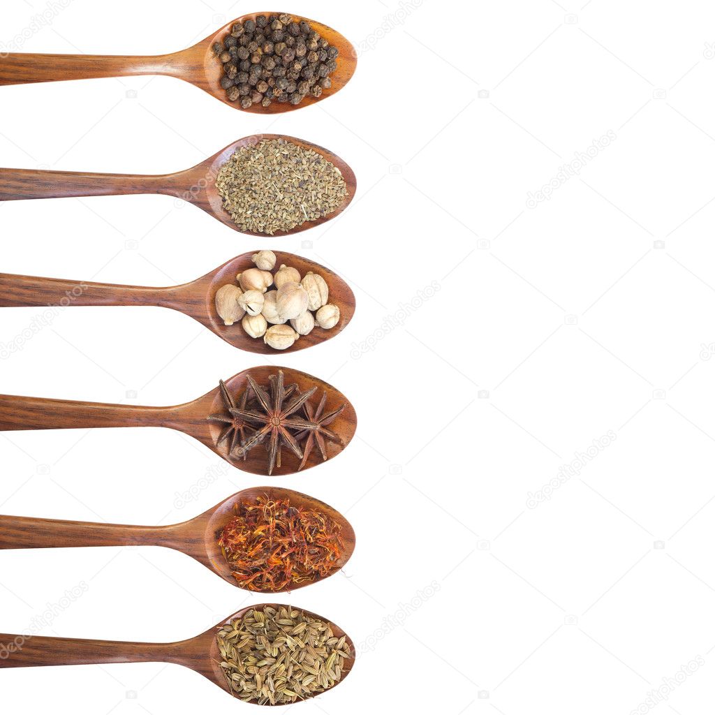 Collection of 6 spices on a wooden spoon