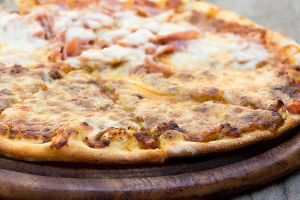 Delicious fresh pizza served on wooden table — Stock Photo, Image