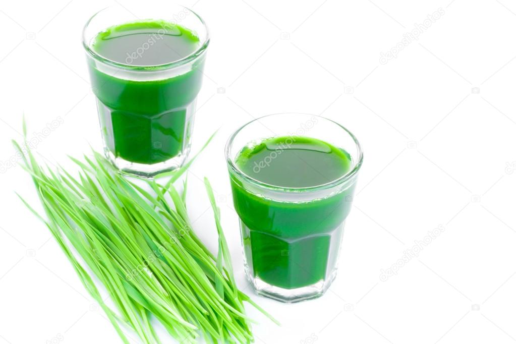 Wheat grass juice on white background