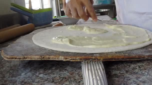 Closeup hand of chef baker making pizza at kitchen — Stock Video