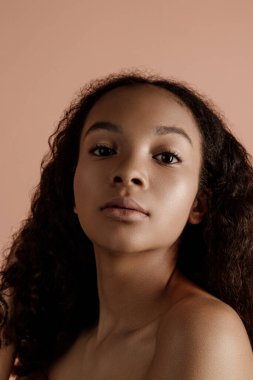 Close up portrait of sensual young female in hat. Clean skin. Healthy care. Portrait of beautiful african american in hat isolated. Studio shoot. Portrait of beauty girl model with natural make up
