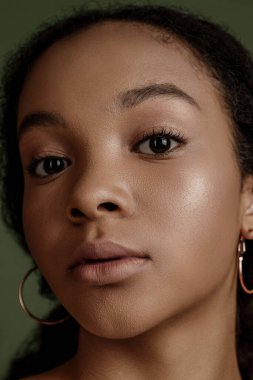 Beauty photo of young elegant African American woman with afro. Hands posing. Gentle portrait.  Fashion beauty close up portrait. Nude make-up. Studio photoshoot. Female model. Beautiful girl
